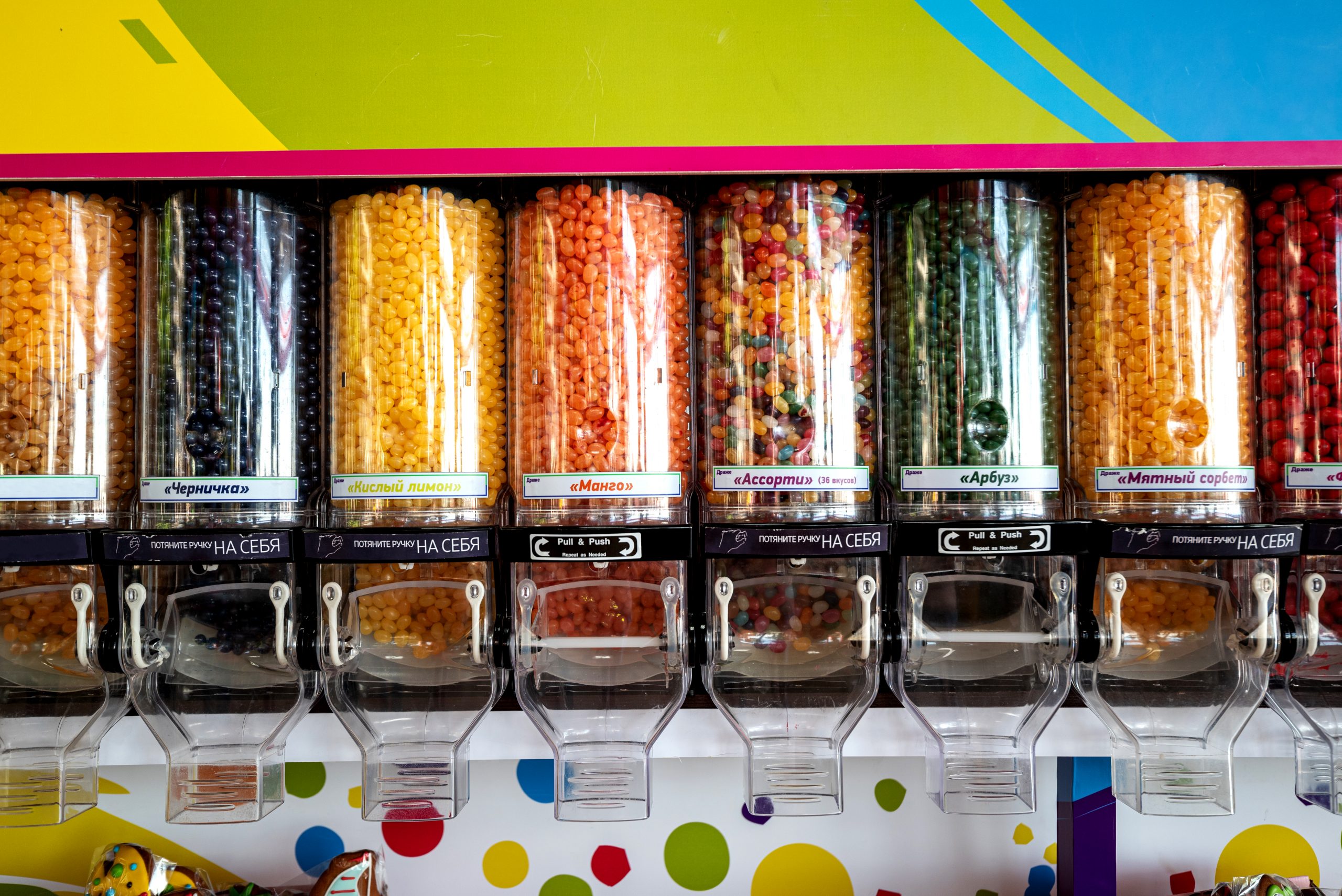 Shop window with colorful sweets, gummies and marmalade